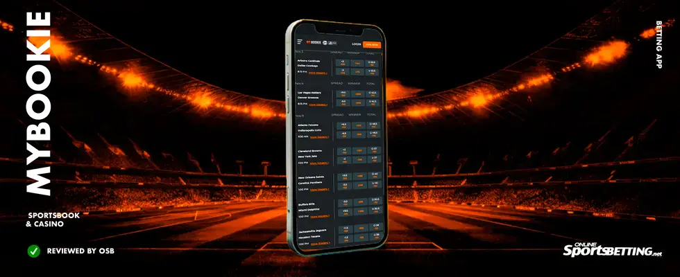MyBookie-sportsbook-app-displayed-on-a-phone-with-an-orange-stadium-background-—-popular-sports-betting-site-for-US-customers