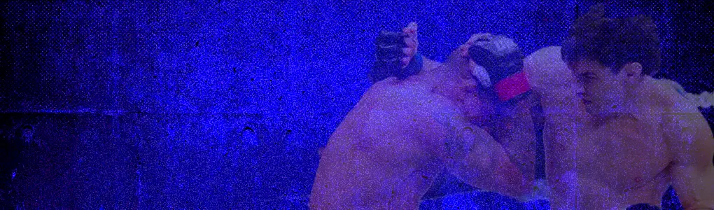 Blue-toned-boxing-scene-with-two-fighters-exchanging-punches-in-close-range.v