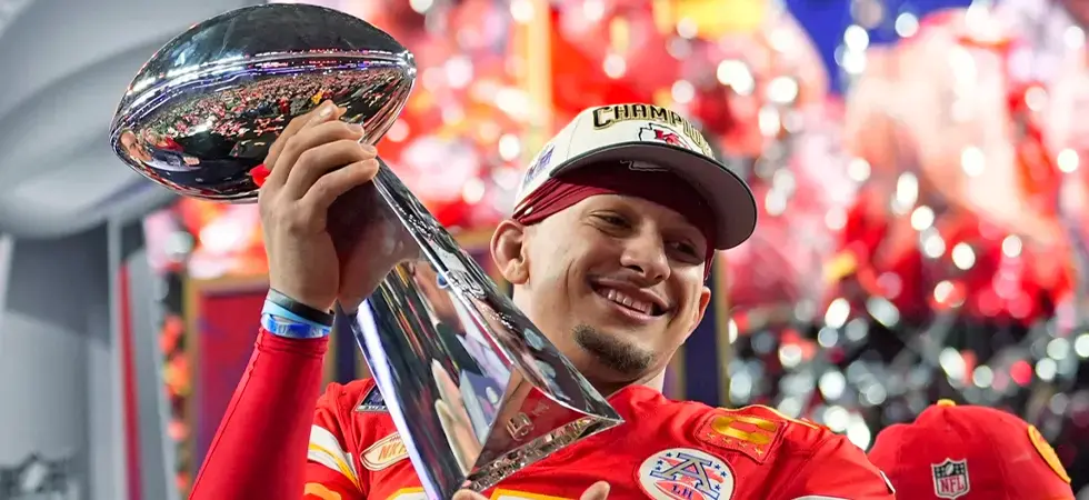 A-NFL-player-winner-holding-the-SuperBowl-trophie