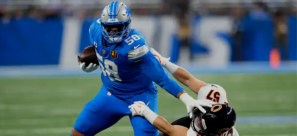 Blue-shirt-NFL-player-fighting-the-ball